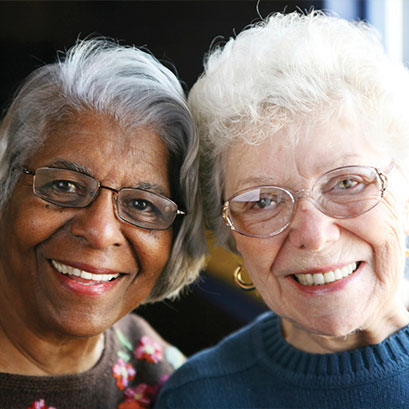 Photo of two women smiling. Link to Life Stage Gift Planner Over Age 70 Situations.
