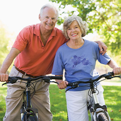 Photo of a man and woman on bicycles. Link to Life Stage Gift Planner Ages 60-70 Situations.