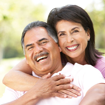 Photo of a couple smiling. Link to Life Stage Gift Planner Under Age 60 Situations.