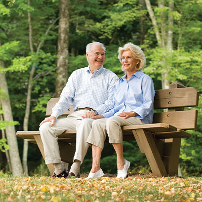 Photo of a couple sitting on a bench. Links to Gifts by Will