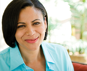 Photo of a woman smiling. Links to Assets to Give